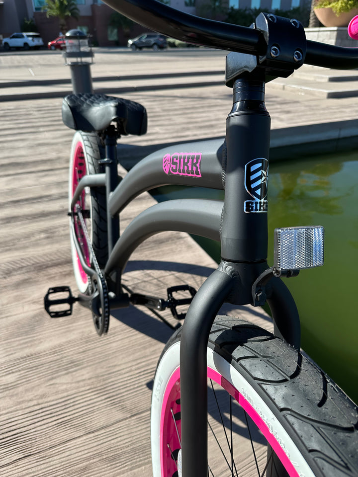 Ladies SIKK Wide Ride SS Aluminum Frame Single Speed Flat Black Frame Pink Wheels Whitewall Tires