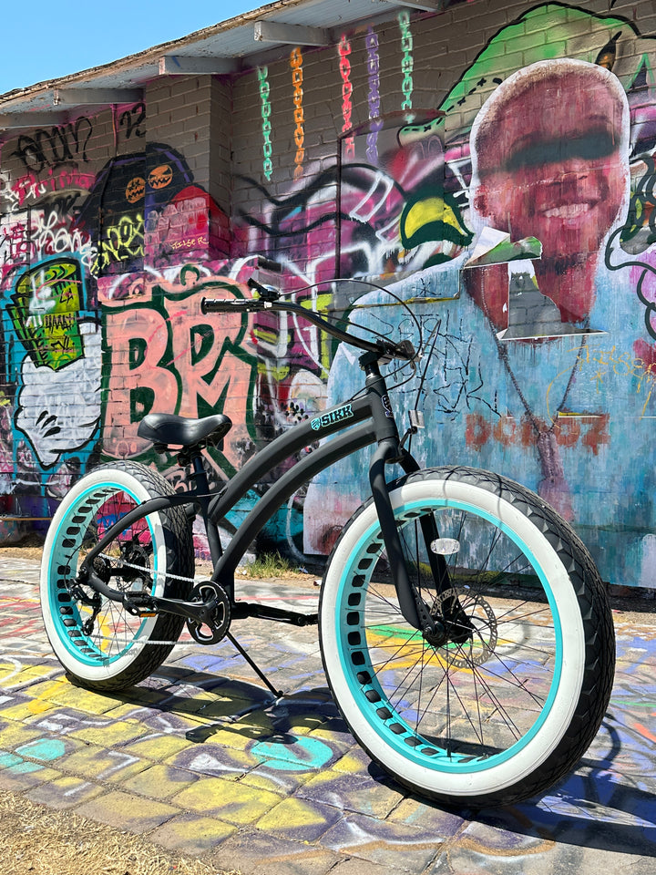SIKK Ladies SS Aluminum Frame Flat Black- Teal 7 Speed UFO Fat Tire Cruiser - SIKK BICYCLES