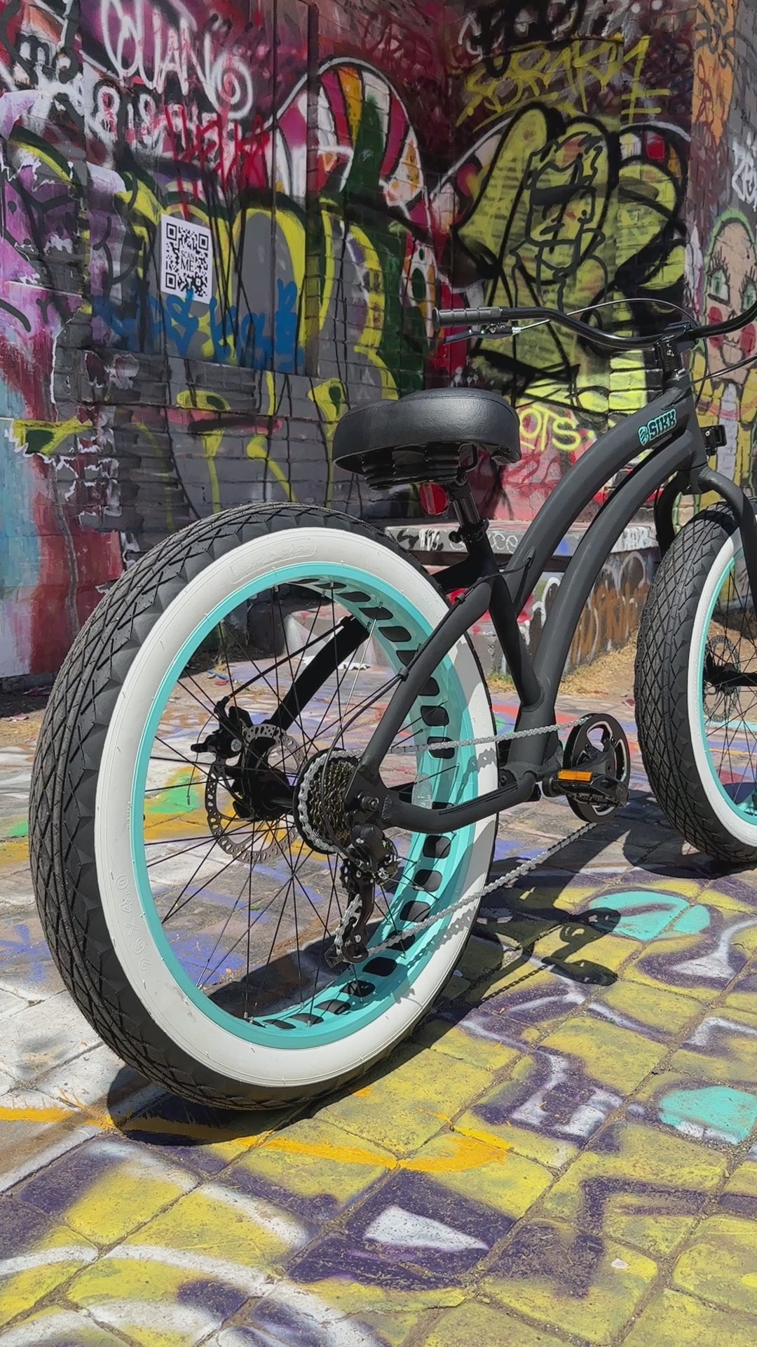 SIKK Ladies SS Aluminum Frame Flat Black- Teal 7 Speed UFO Fat Tire Cruiser