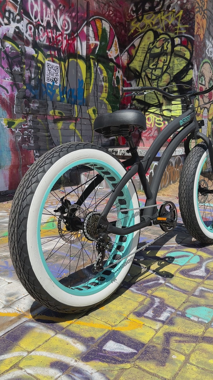 SIKK Ladies SS Aluminum Frame Flat Black- Teal 7 Speed UFO Fat Tire Cruiser